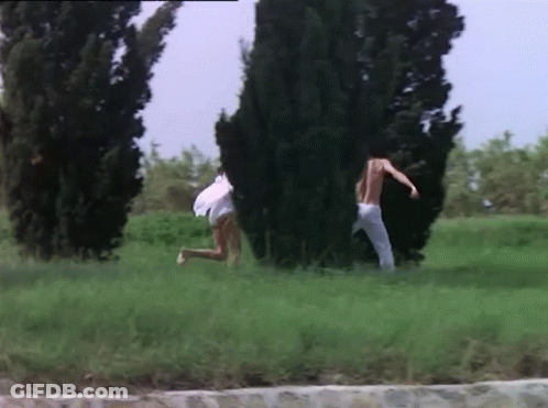 Man And Woman Running In Grassy Field GIF