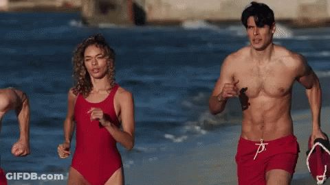 Man And Woman Running On Beach GIF