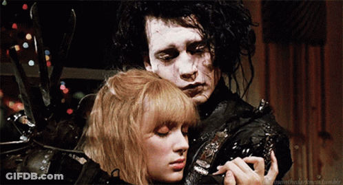 Man And Woman Saying The Rose And The Darkness GIF
