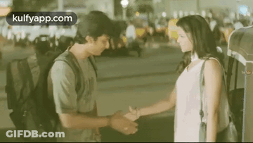 Man And Woman Shaking Hands At Night GIF