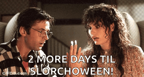 Man And Woman Sitting 2 More Days Til Slorchoween GIF