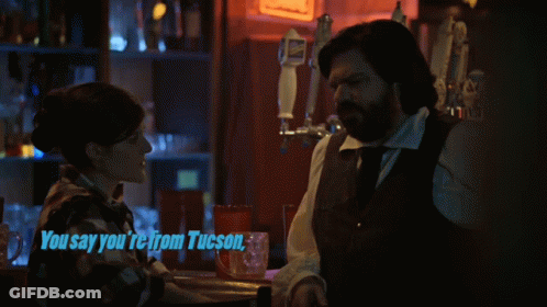 Man And Woman Sitting At Bar GIF