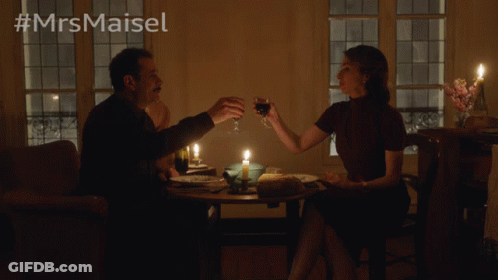Man And Woman Sitting At Candlelit Table GIF