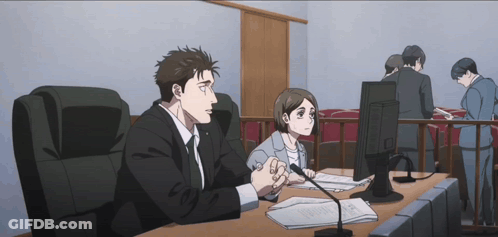 Man And Woman Sitting At Desk GIF