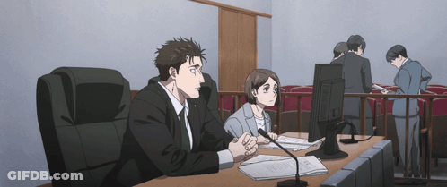 Man And Woman Sitting At Desk With Computer GIF