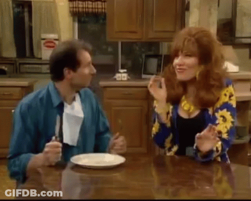 Man And Woman Sitting At Kitchen Table GIF