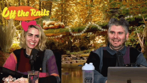 Man And Woman Sitting At Off The Rails Sign GIF