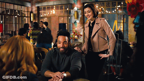 Man And Woman Sitting At Restaurant Table GIF