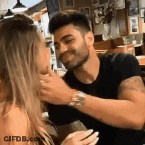 Man And Woman Sitting At Restaurant Table GIF