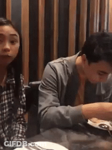 Man And Woman Sitting At Restaurant Table GIF