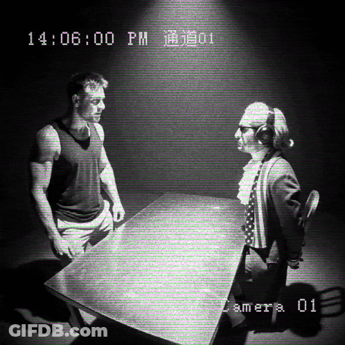 Man And Woman Sitting At Table 14:06 PM GIF