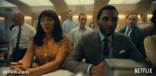 Man And Woman Sitting At Table GIF