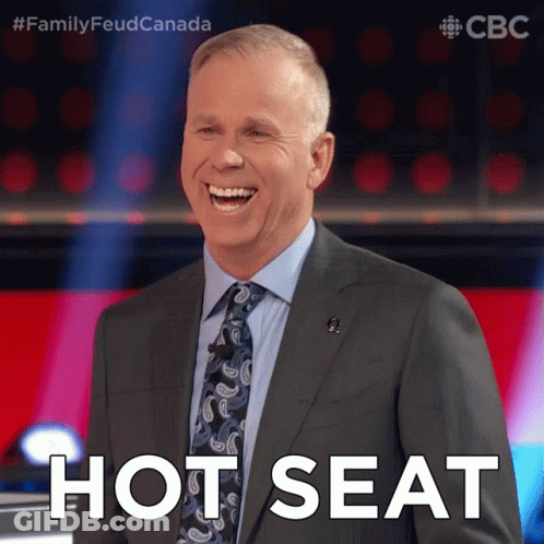 Man And Woman Sitting At Table At 14:06 GIF