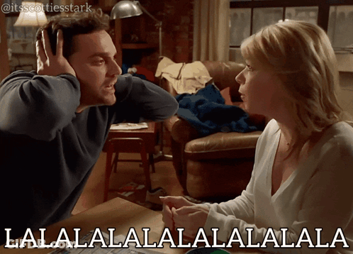 Man And Woman Sitting At Table GIF