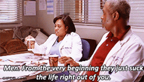 Man And Woman Sitting At Table GIF