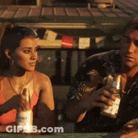 Man And Woman Sitting At Table Holding Alcohol Bottles GIF