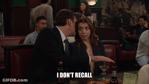 Man And Woman Sitting At Table Saying I Don't Recall GIF