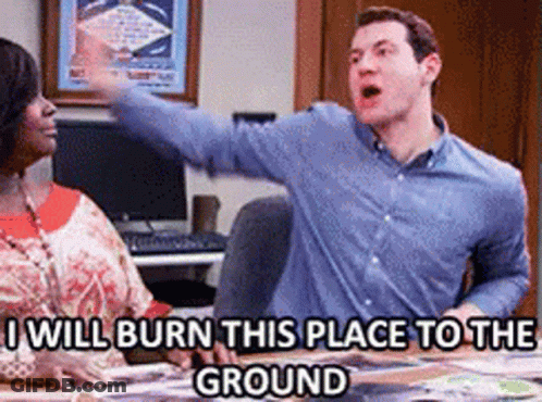 Man And Woman Sitting At Table Saying I Will Burn This Place To The Ground GIF
