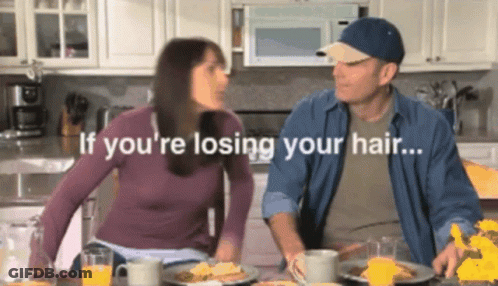 Man And Woman Sitting At Table Saying If You're Losing Your Hair GIF