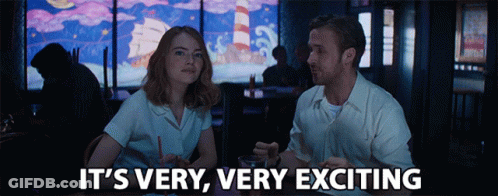 Man And Woman Sitting At Table Saying It's Very Very Exciting GIF