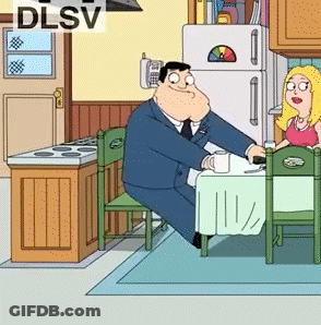 Man And Woman Sitting At Table With DLSV GIF