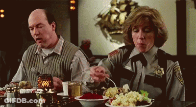 Man And Woman Sitting At Table With Food GIF