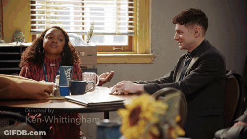 Man And Woman Sitting At Table With Ken Whittingham GIF