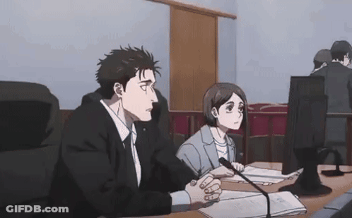 Man And Woman Sitting At Table With Microphone GIF