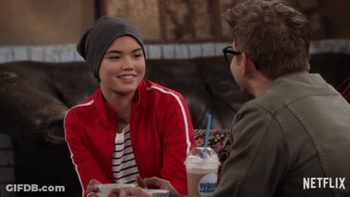 Man And Woman Sitting At Table With Whipped Cream GIF