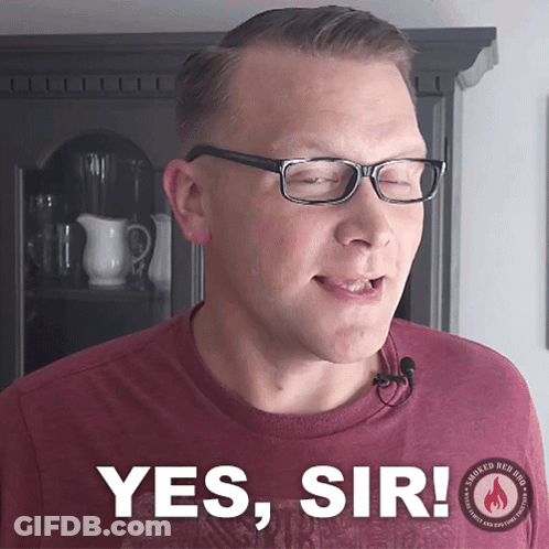 Man And Woman Sitting At Table Woman Wearing Share The Love Shirt GIF