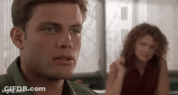 Man And Woman Sitting At Table GIF