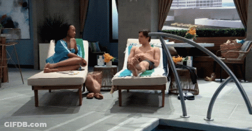 Man And Woman Sitting By Pool GIF
