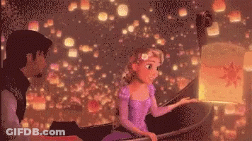 Man And Woman Sitting In Boat Looking At Lanterns GIF