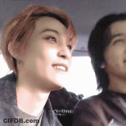Man And Woman Sitting In Car With Moon Sweatshirt GIF