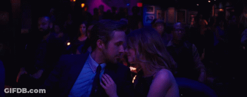 Man And Woman Sitting In Dark Room GIF