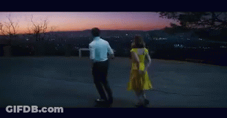 Man And Woman Sitting In Dark Room GIF