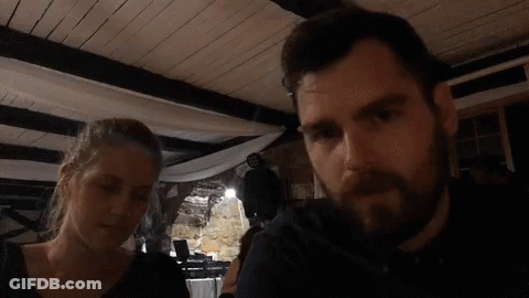 Man And Woman Sitting In Dark Room GIF
