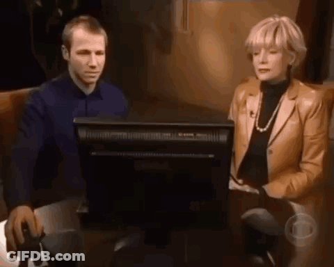 Man And Woman Sitting In Front Of Computer Monitor GIF