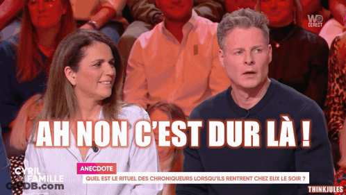 Man And Woman Sitting In Front Of Crowd Saying Ah Non C'est Dur La GIF