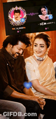 Man And Woman Sitting In Front Of Screen GIF