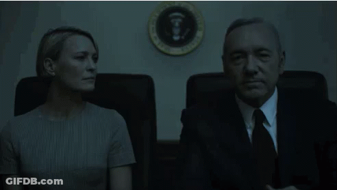Man And Woman Sitting In Front Of White House Seal GIF