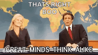 Man And Woman Sitting In Front Of World Map GIF