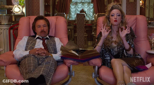 Man And Woman Sitting In Pink Chairs GIF