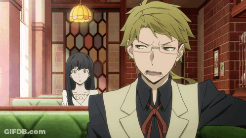 Man And Woman Sitting In Room With Brick Wall GIF