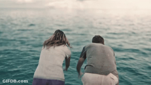 Man And Woman Sitting In Water GIF