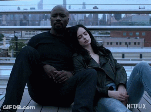 Man And Woman Sitting Next To Each Other GIF