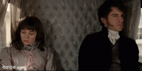 Man And Woman Sitting Next To Each Other GIF