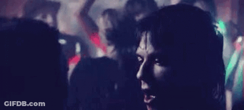 Man And Woman Sitting Next To Each Other In Room GIF