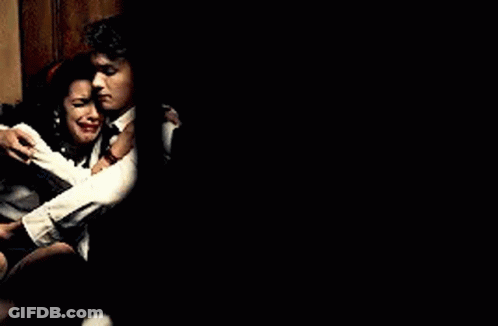 Man And Woman Sitting Next To Each Other GIF