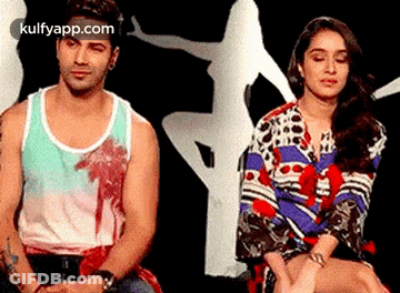 Man And Woman Sitting Next To Each Other GIF